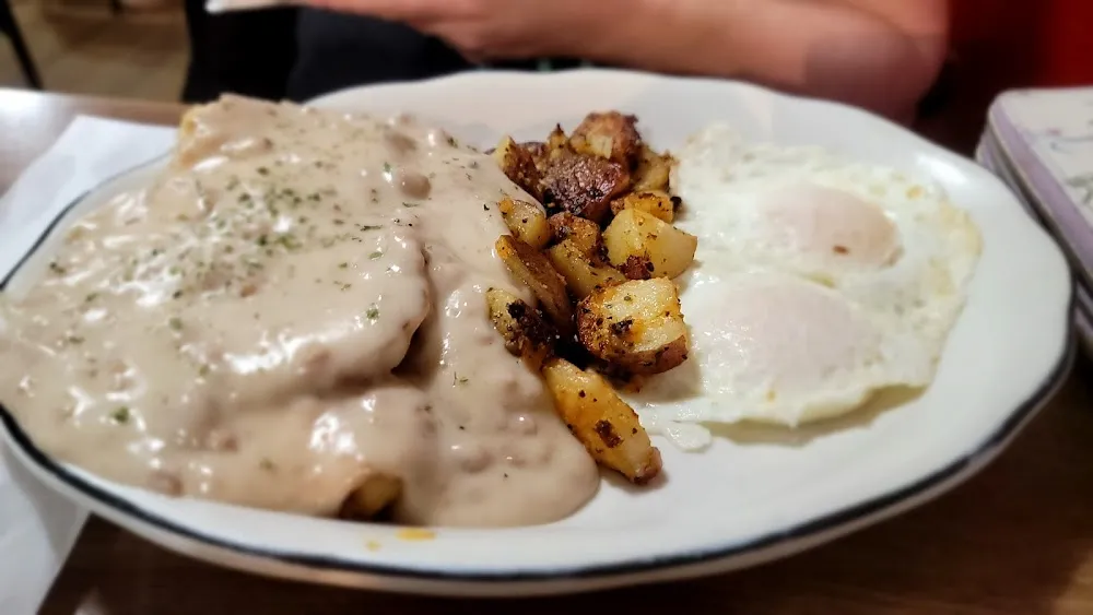 Sausage Gravy over Biscuits with 2 Eggs and Homefries